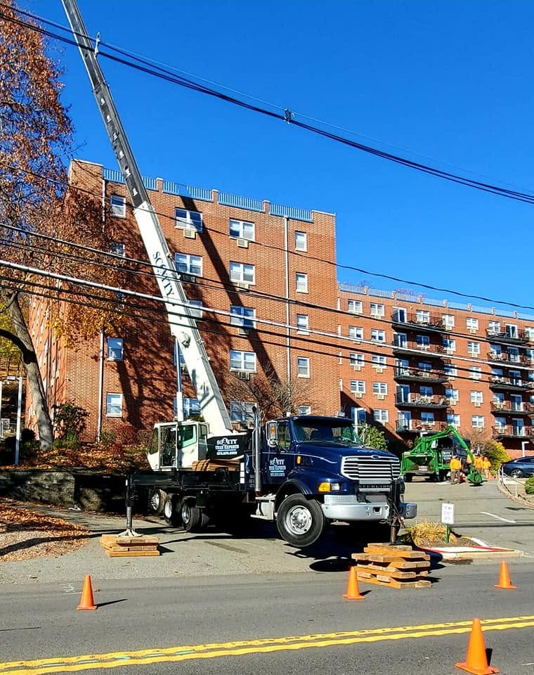 Crane working near an apartment complex